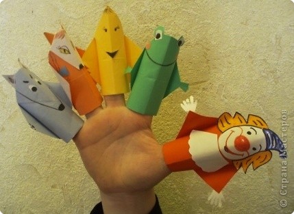 У меня всегда под рукой серия пальчиковых кукол оригами. Я использую их для занятий физкультурой и для минутного отдыха во время уроков оригами. Дети любят изображать различных сказочных персонажей и очень любят пальчиковых кукол. Фото 1